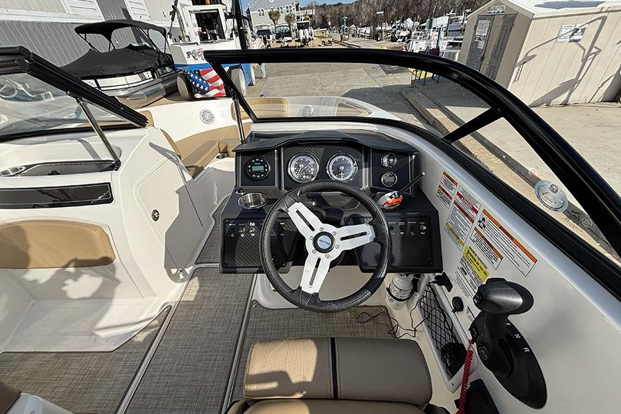 2023 Bayliner VR5 Bowrider OB dashboard with steering wheel and control panel.