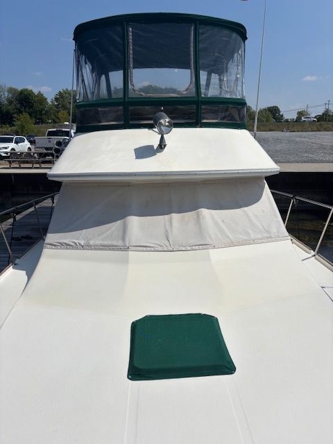 1986 Sea Ray 360 Aft Cabin on water, front view.