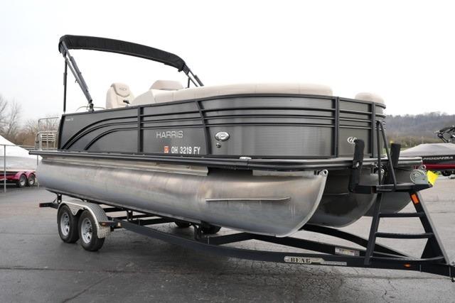 2021 Harris Sunliner 230 pontoon boat on trailer, side view.