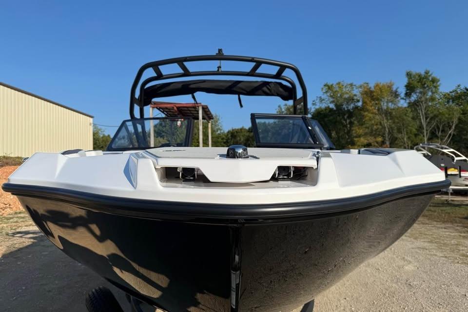 2026 Yamaha Boats AR220, sleek design, front view, outdoors, clear sky background.