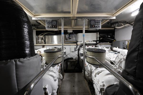 Engine room of a 2001 Grand Harbour 76 yacht with dual engines and control panels.