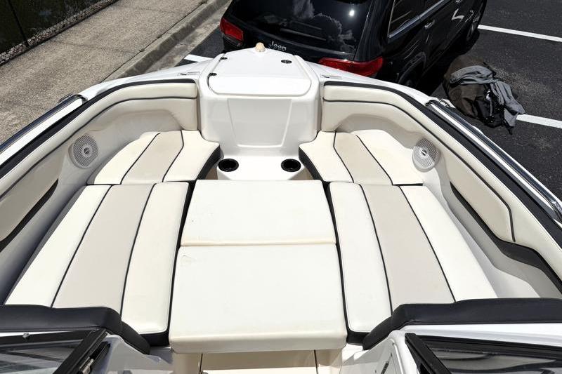 2017 Yamaha Boats SX210 interior with white cushioned seating and cup holders.