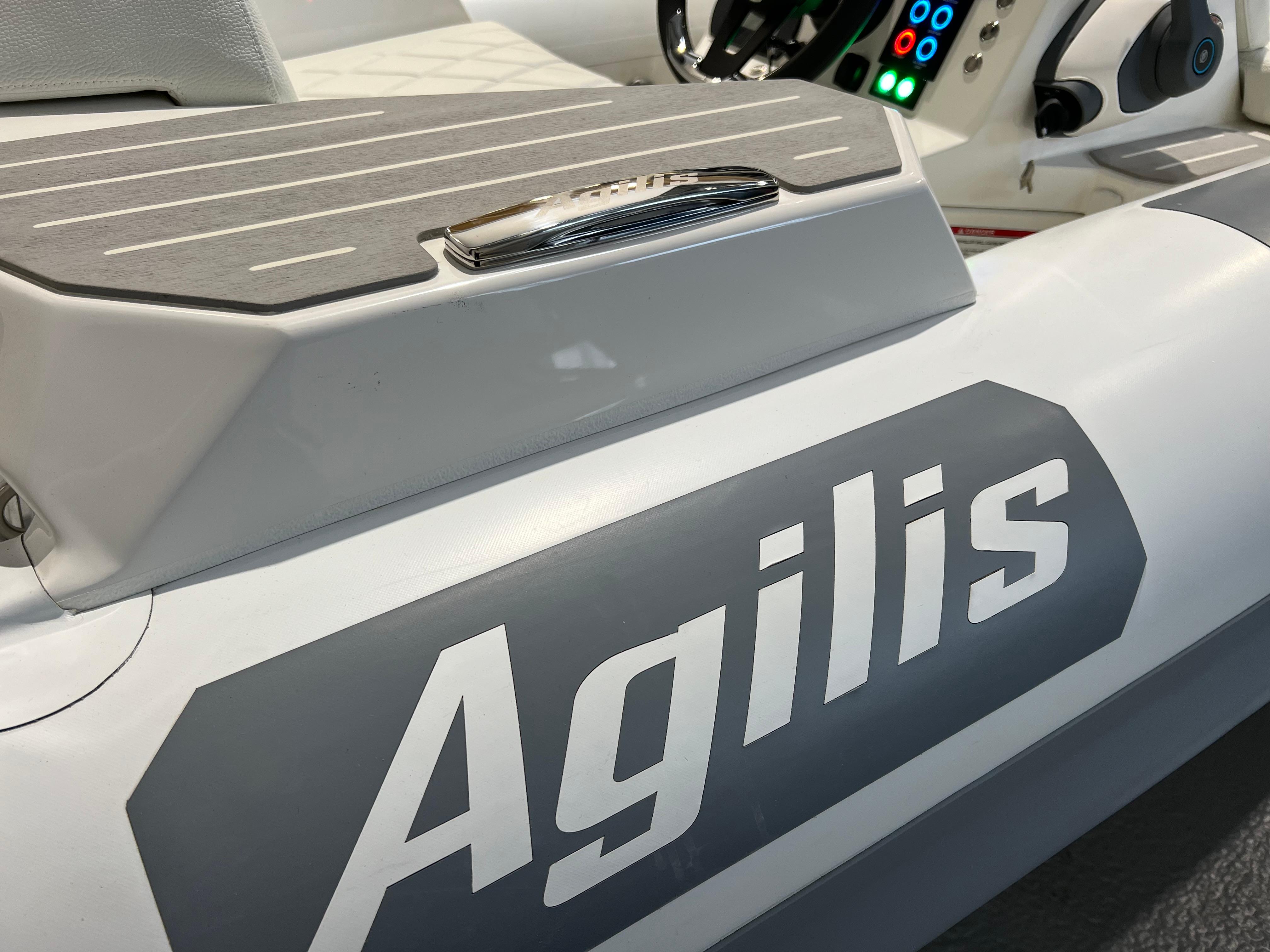 2025 Agilis 280 boat interior with control panel and branding.