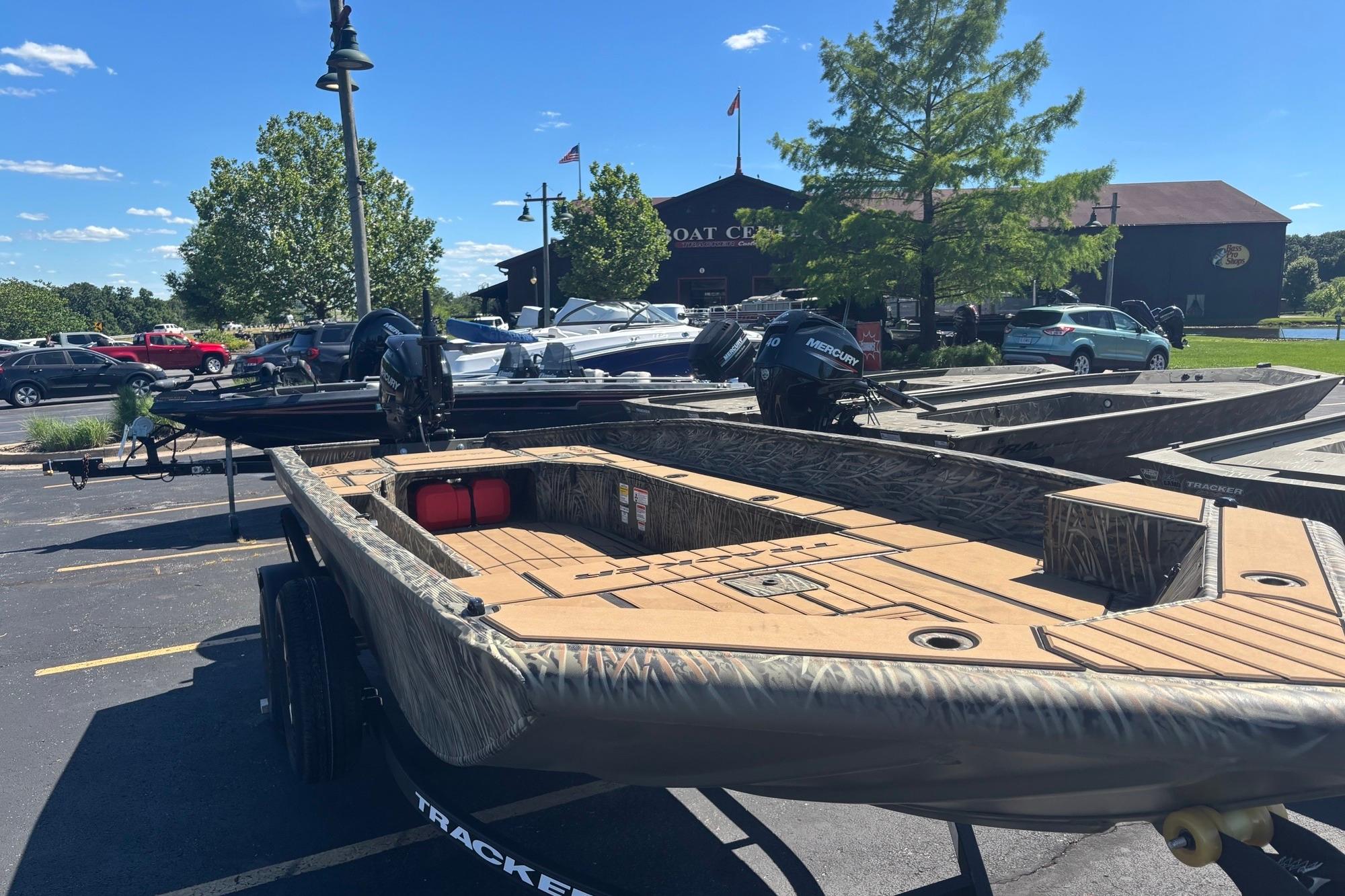2026 Tracker Grizzly 1756 T Marsh boat displayed outdoors at a boat center.