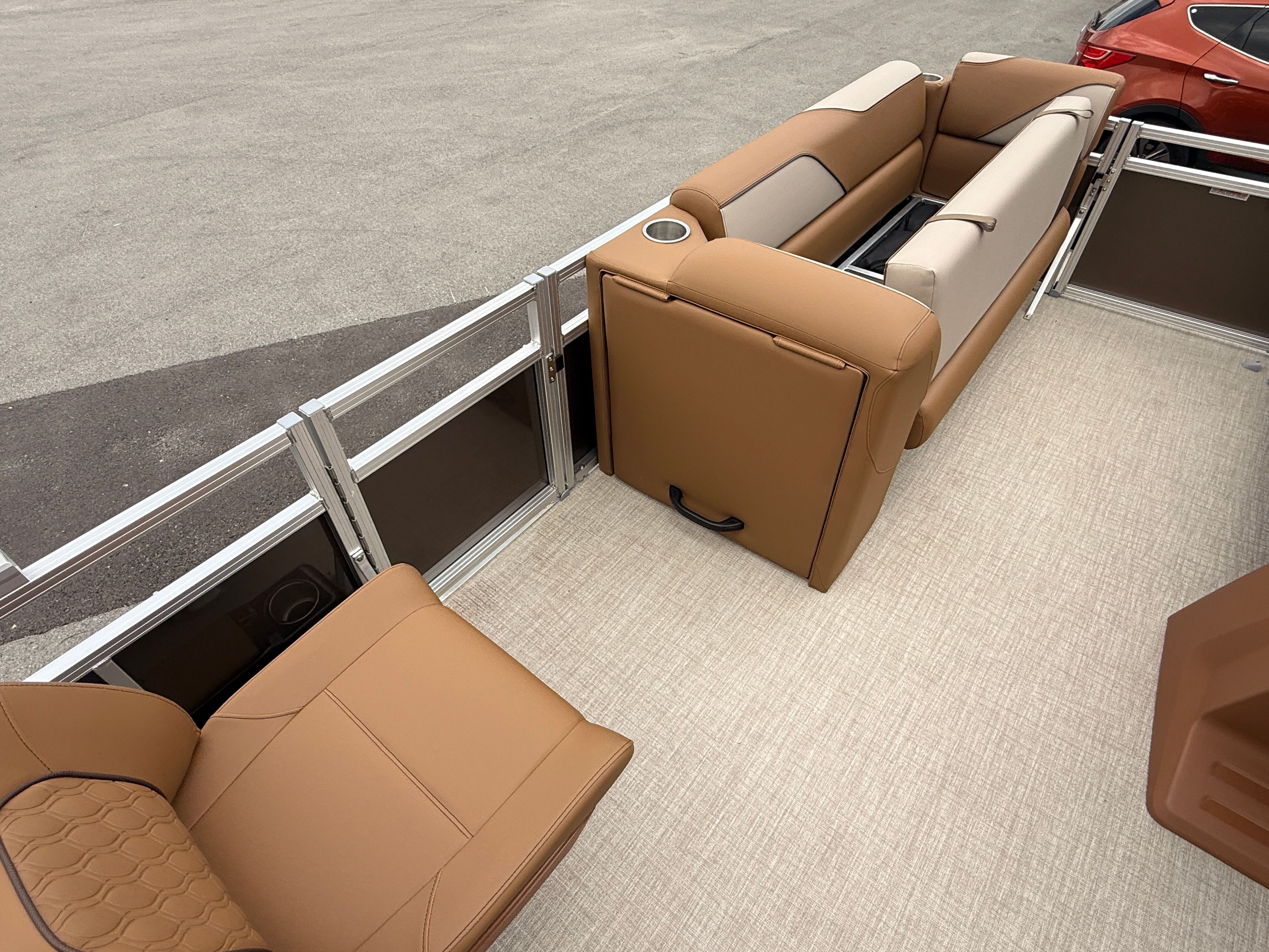 Interior of 2026 Tahoe 2380 Sport Quad Lounger with beige leather seating.