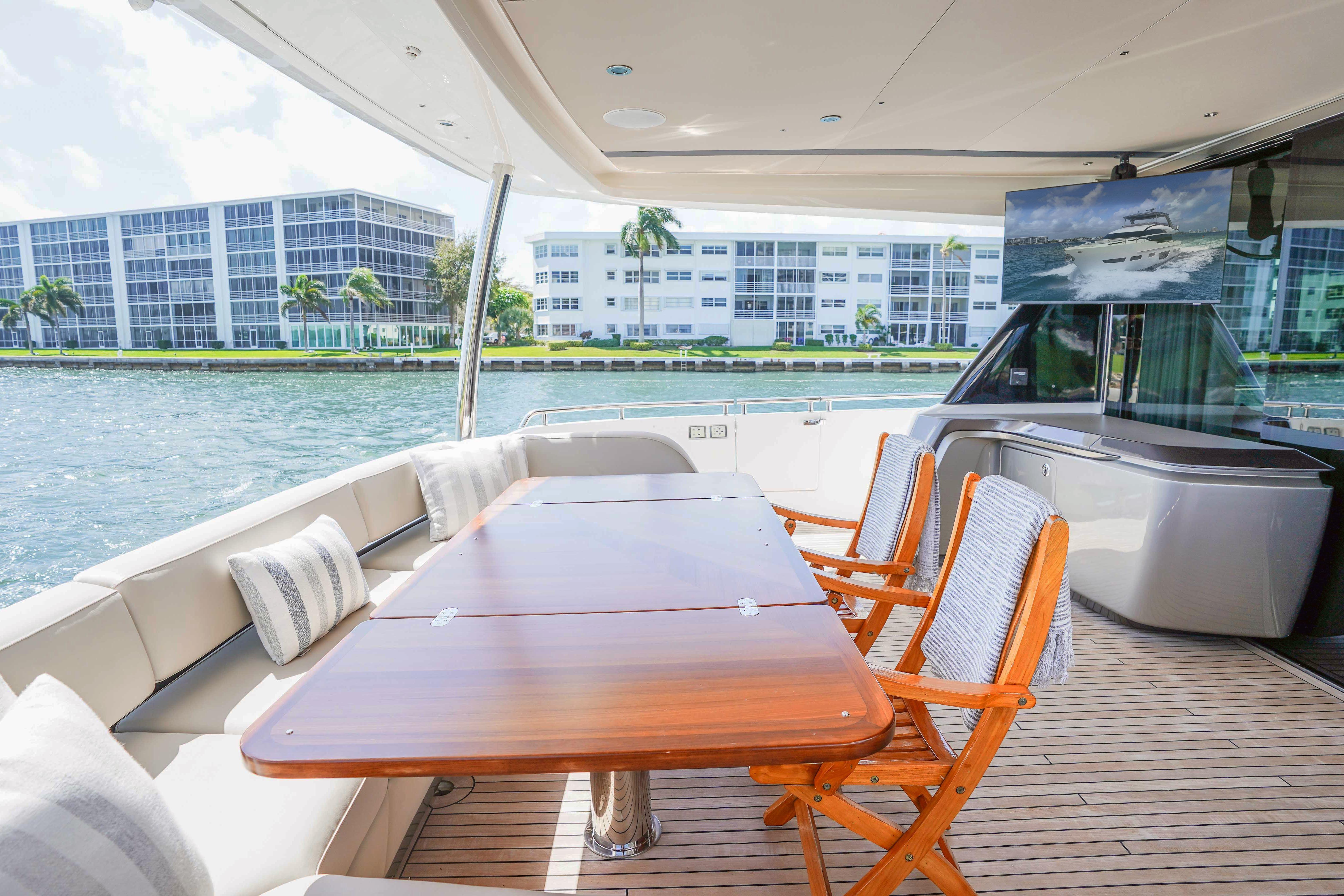 Luxurious 2021 Princess Y85 yacht deck with elegant seating and waterfront view.