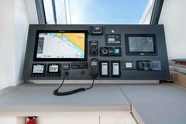 Control panel of 2025 Privilege Signature 580 yacht with navigation and communication systems.