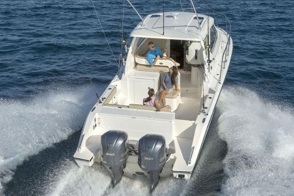 Manufacturer Provided Image: 2021 Pursuit OS 325 Offshore boat cruising on open water.