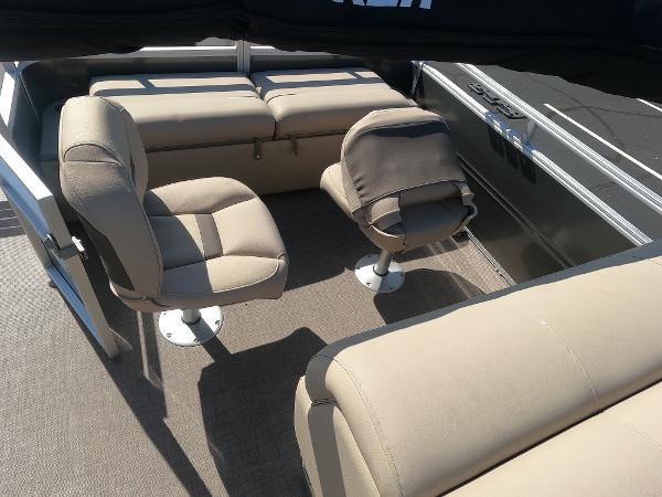 2024 Sun Tracker Fishin' Barge 22 XP3 interior seating area with beige upholstery.