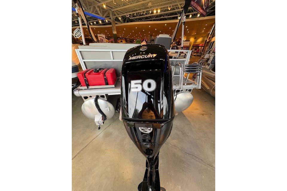 2026 Sun Tracker Bass Buggy 16 XL Select with Mercury 50 outboard motor in showroom.