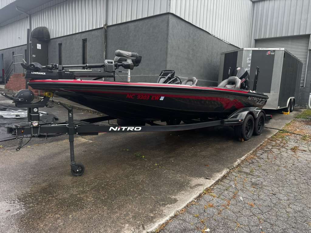 2022 Nitro Z21 XL Pro boat on trailer outside building.