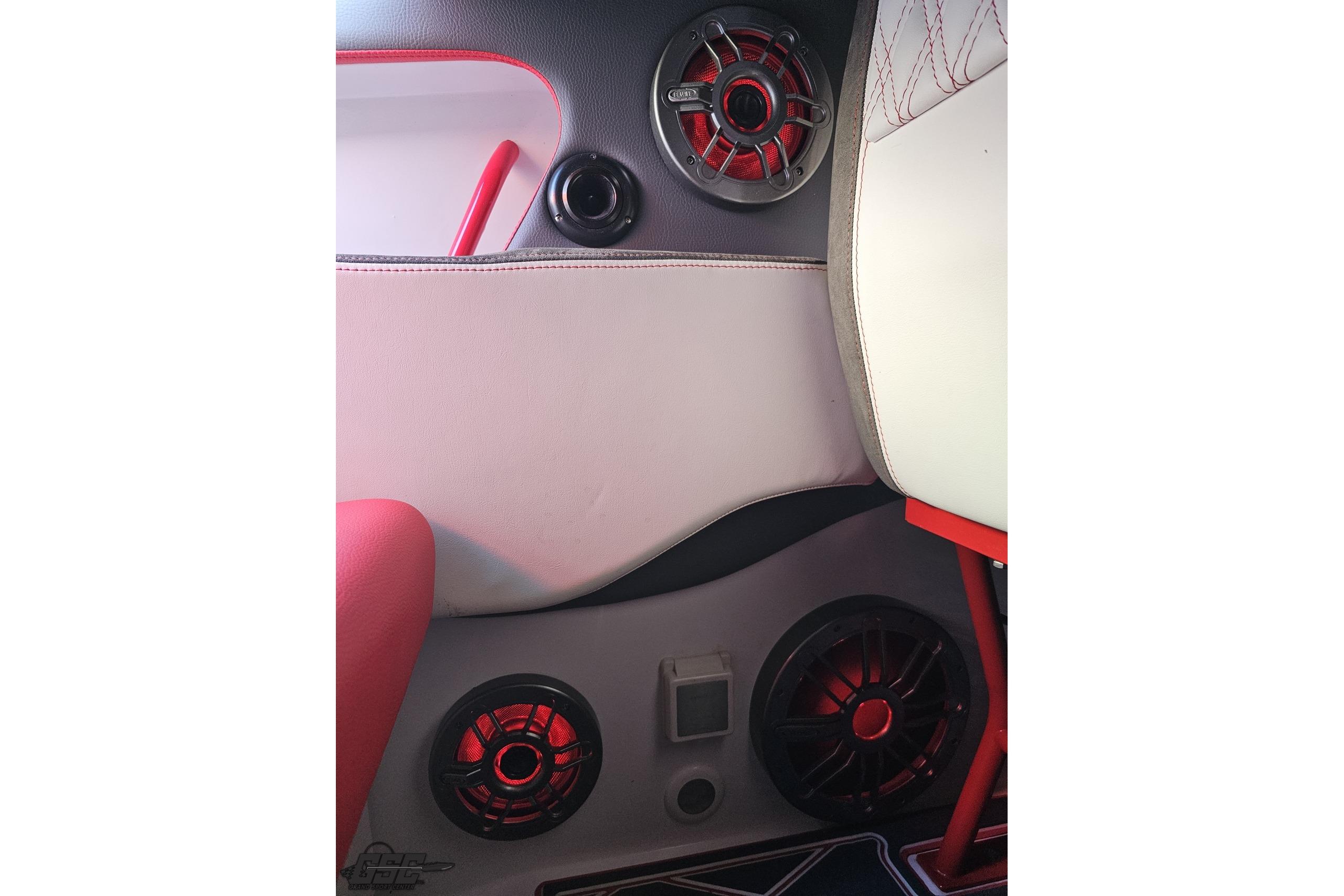 Interior of 2008 Donzi 38 ZR boat featuring red-accented speakers and seating.