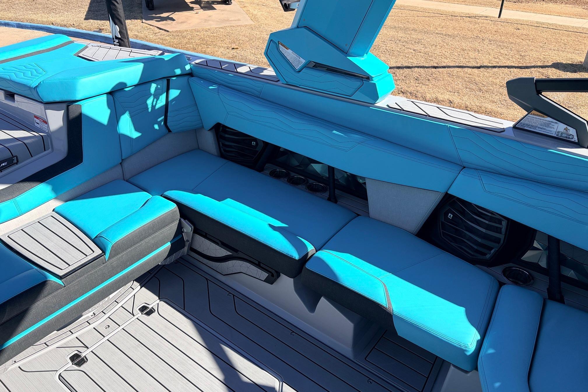 Interior of 2026 Nautique Super Air Nautique G23 with blue seating and modern design.