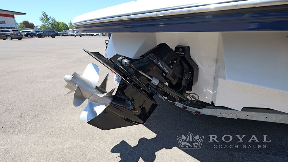 Rear view of a Sea Ray SLX 230 with an outboard motor.