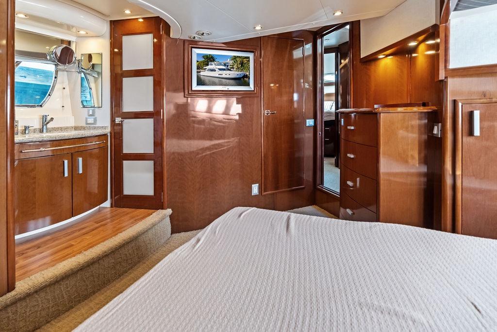 Luxurious interior of 2009 Carver 56 Voyager SE yacht with wood finishes and modern amenities.