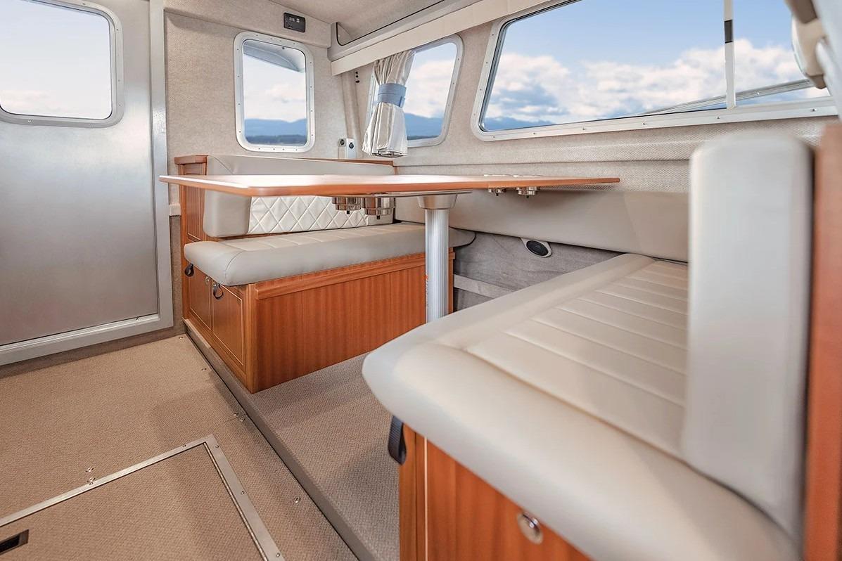 Interior of 2026 KingFisher 3225 GFX Offshore boat with seating and table.