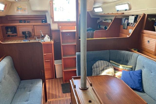 Interior of 1988 Westerly Corsair 36 sailboat with cozy seating and wooden finishes.