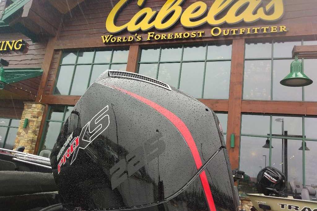 Nitro ZV19 Sport Pro 2026 boat engine outside Cabela's store in rainy weather.