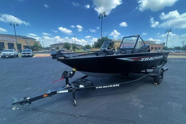2026 Tracker Pro Guide V-175 Combo boat on trailer, parked outdoors under a blue sky.