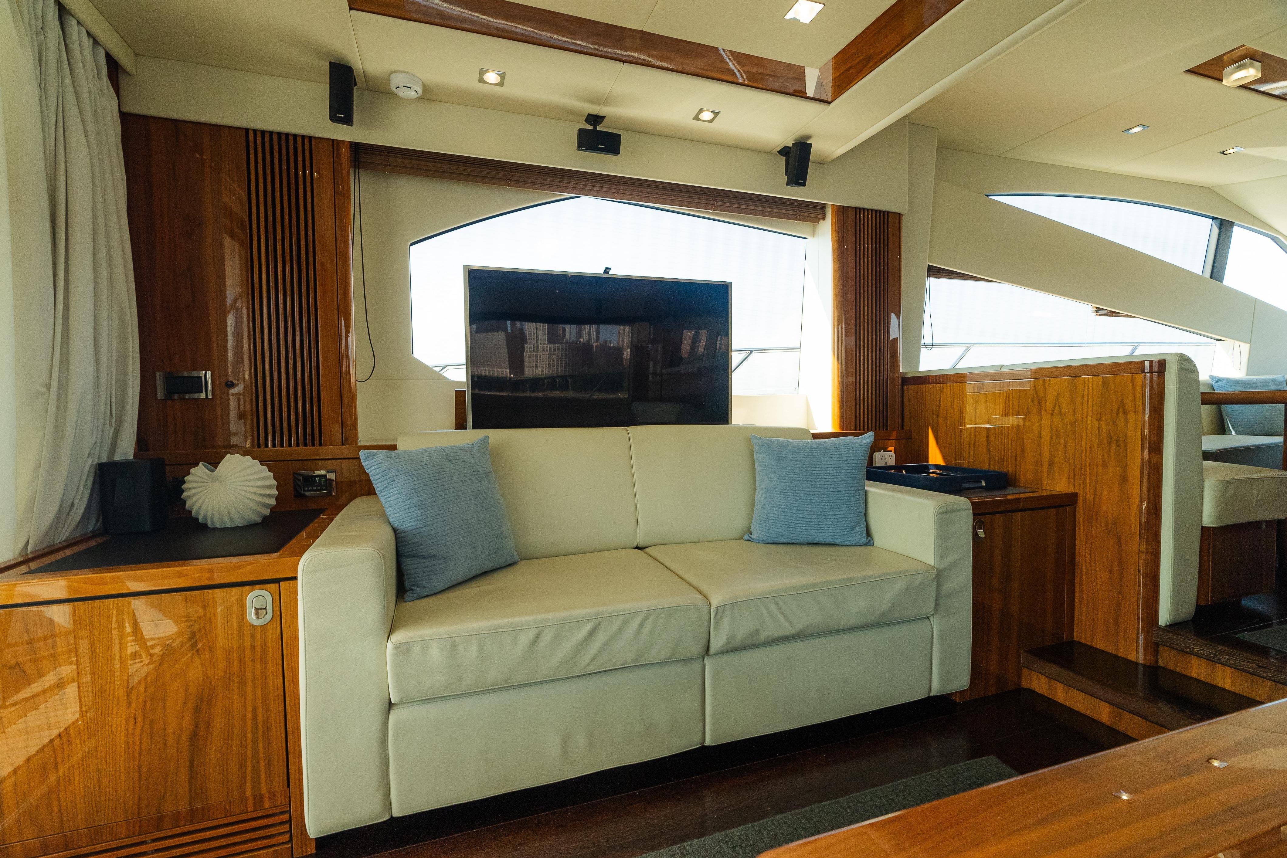 Luxurious interior of 2016 Sunseeker Manhattan 65 yacht with elegant wood finishes.