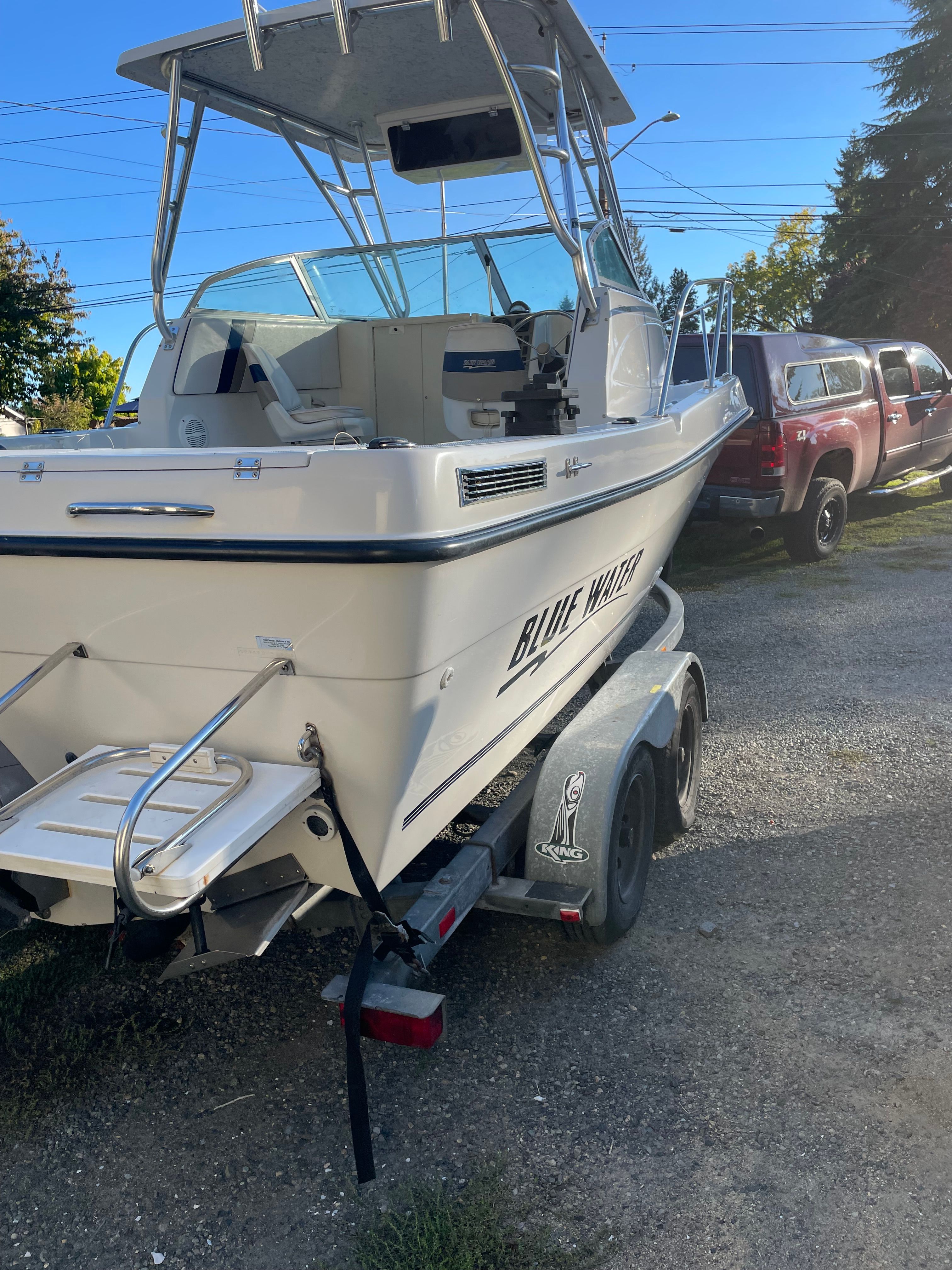 A 2001 Bluewater 2100 Sport Fisher on a trailer, ready for use.
