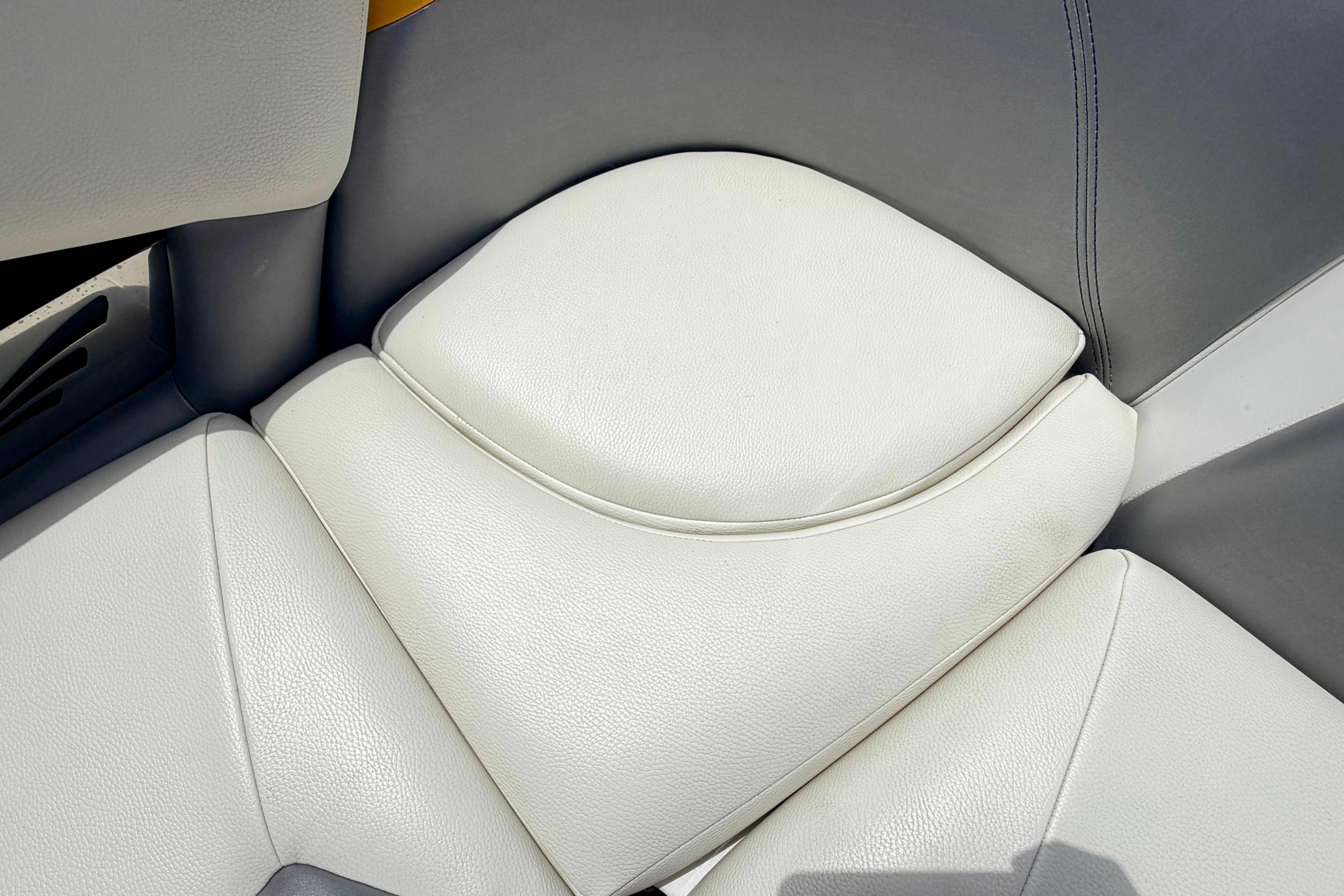 2014 Tigé R20 boat interior with white and gray leather seating.