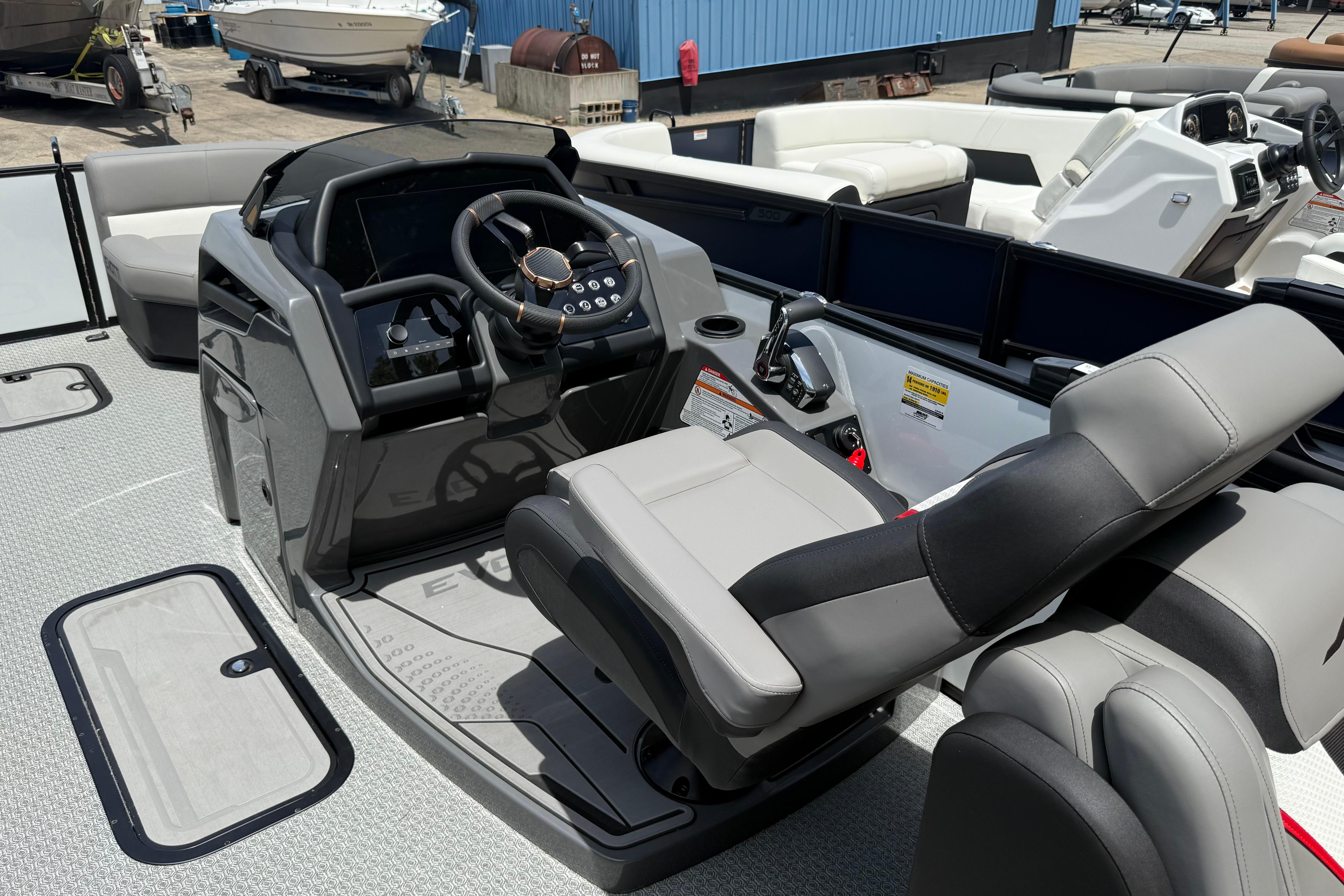 2026 Evotti 723QL boat interior with modern steering console and comfortable seating.