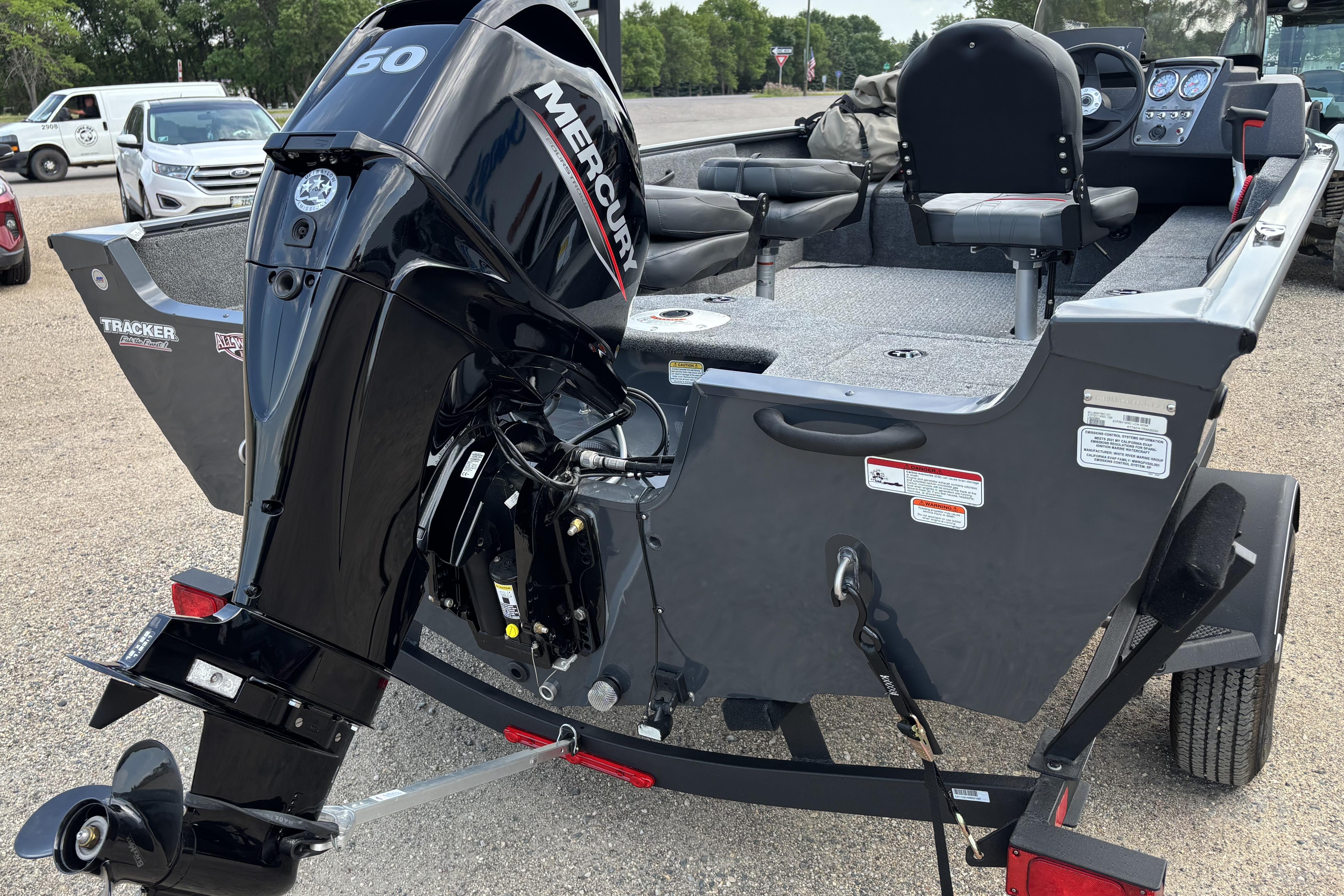 2021 Tracker Pro Guide V-16 WT boat with Mercury 60 engine, parked on a trailer.