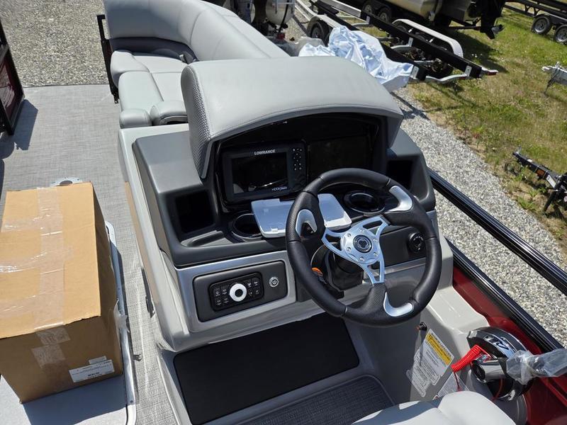 2025 Regency 230 DL3 boat dashboard with steering wheel and control panel.