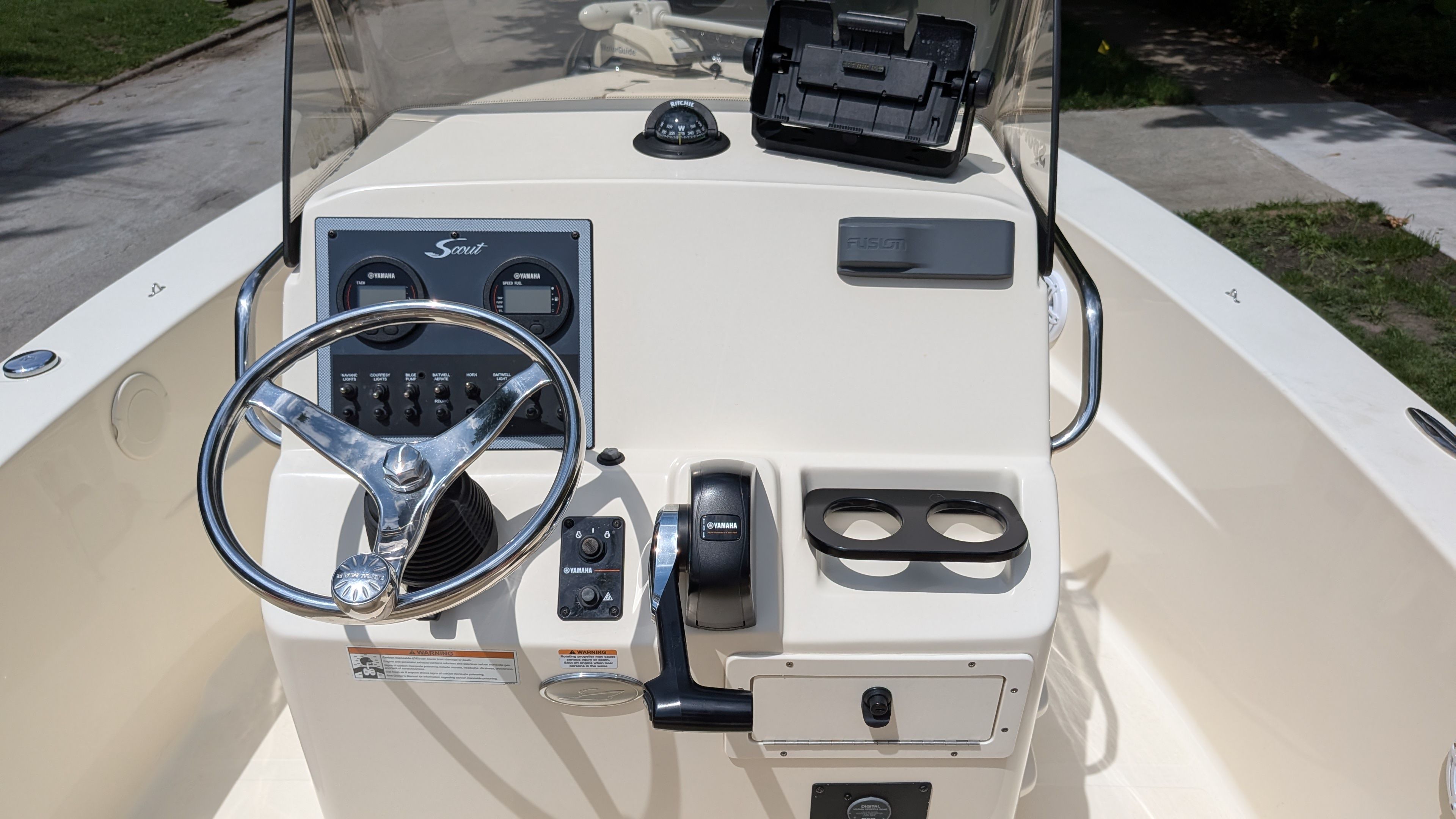 The image shows the helm of a 2021 Scout 195 Sportfish boat.