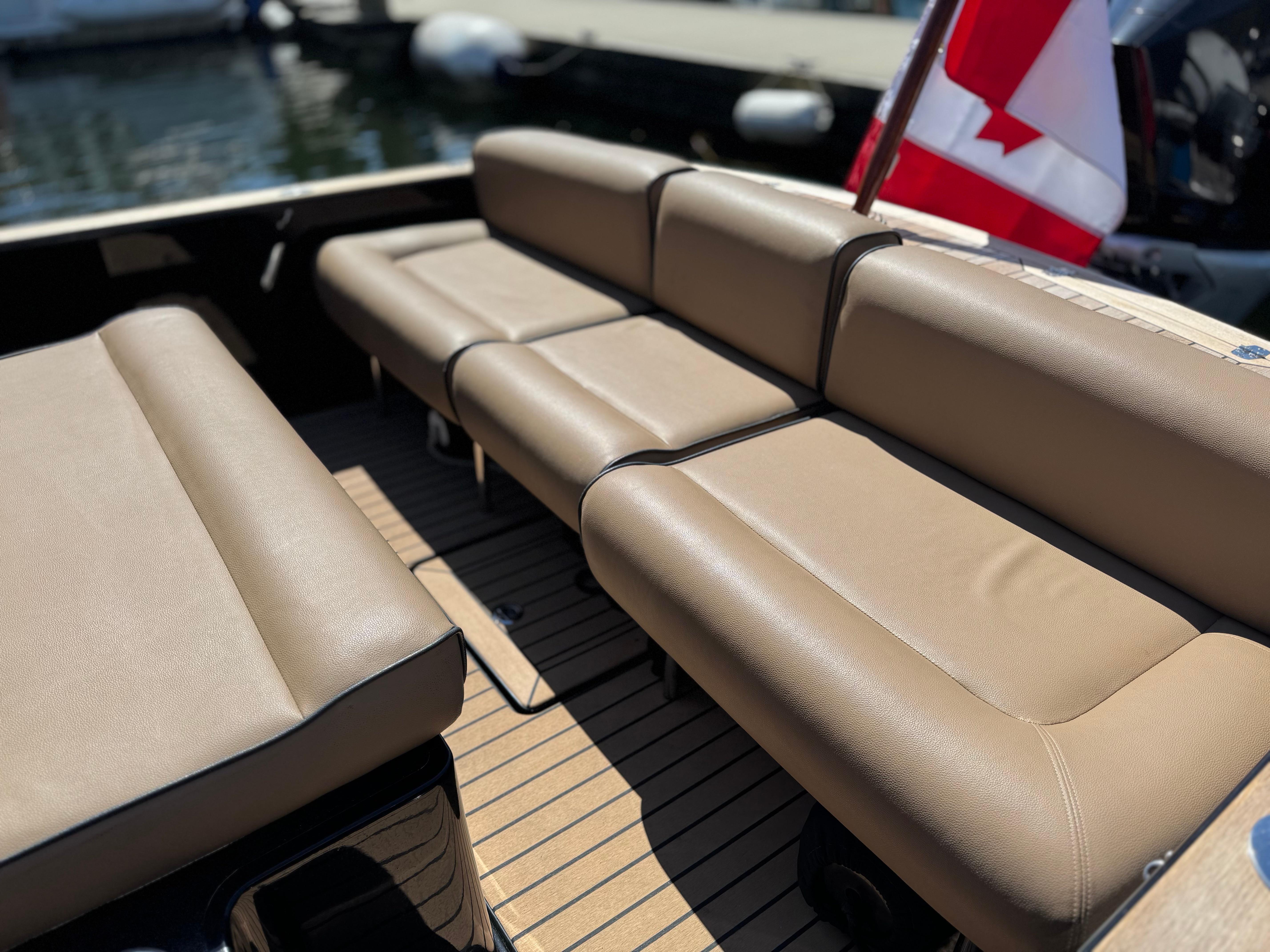 2021 Hunt Yachts Harrier 26 interior with tan leather seating and Canadian flag.