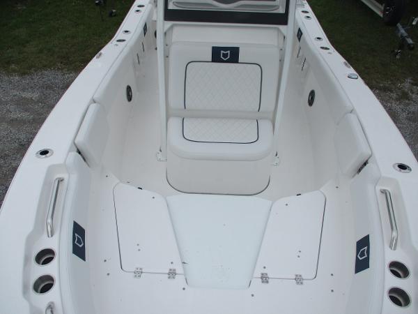 2025 Sea Fox 228 Commander boat interior with white seating and storage compartments.