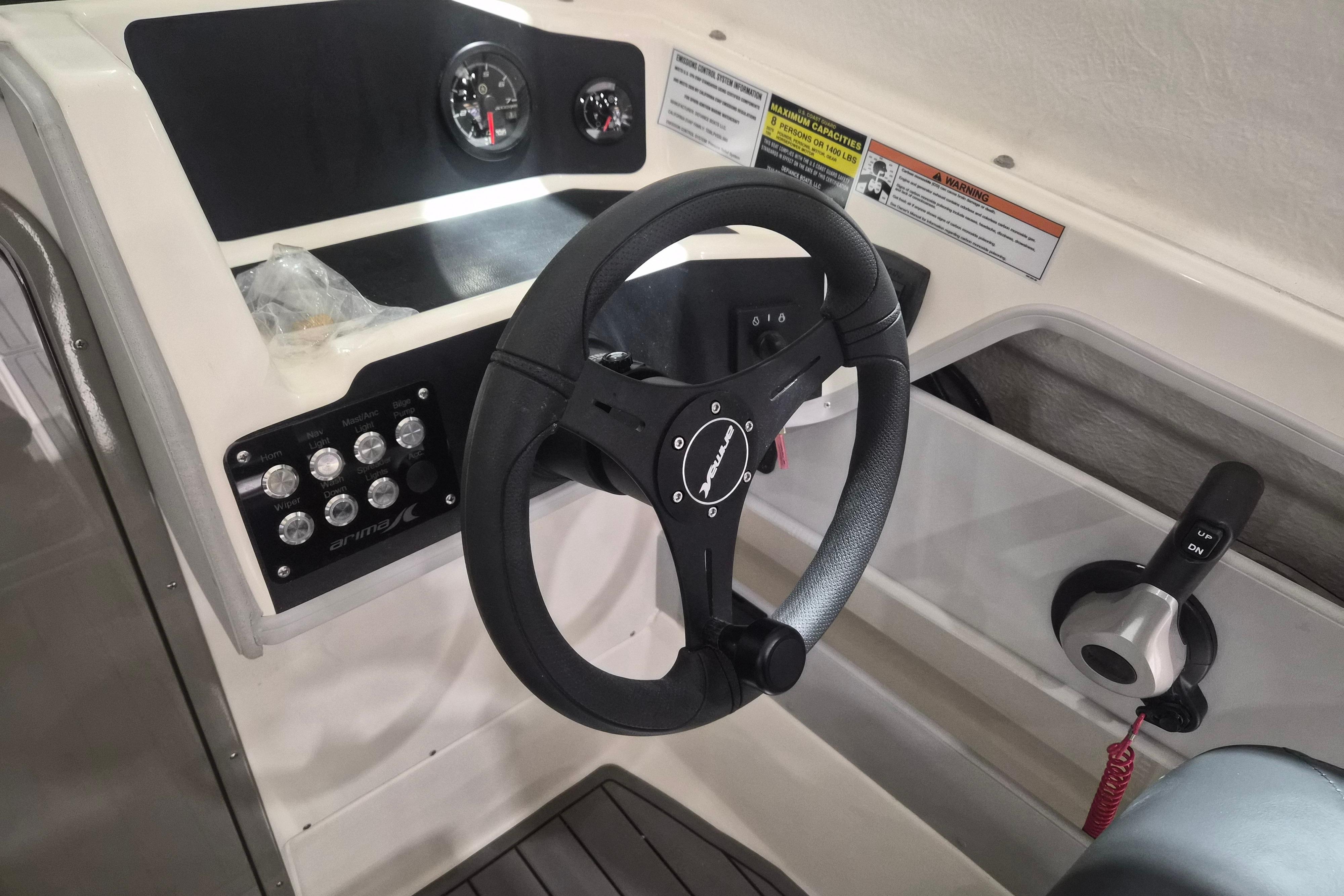 Steering console of 2026 Arima Sea Chaser 19 Yellowtail Edition boat, featuring modern controls.