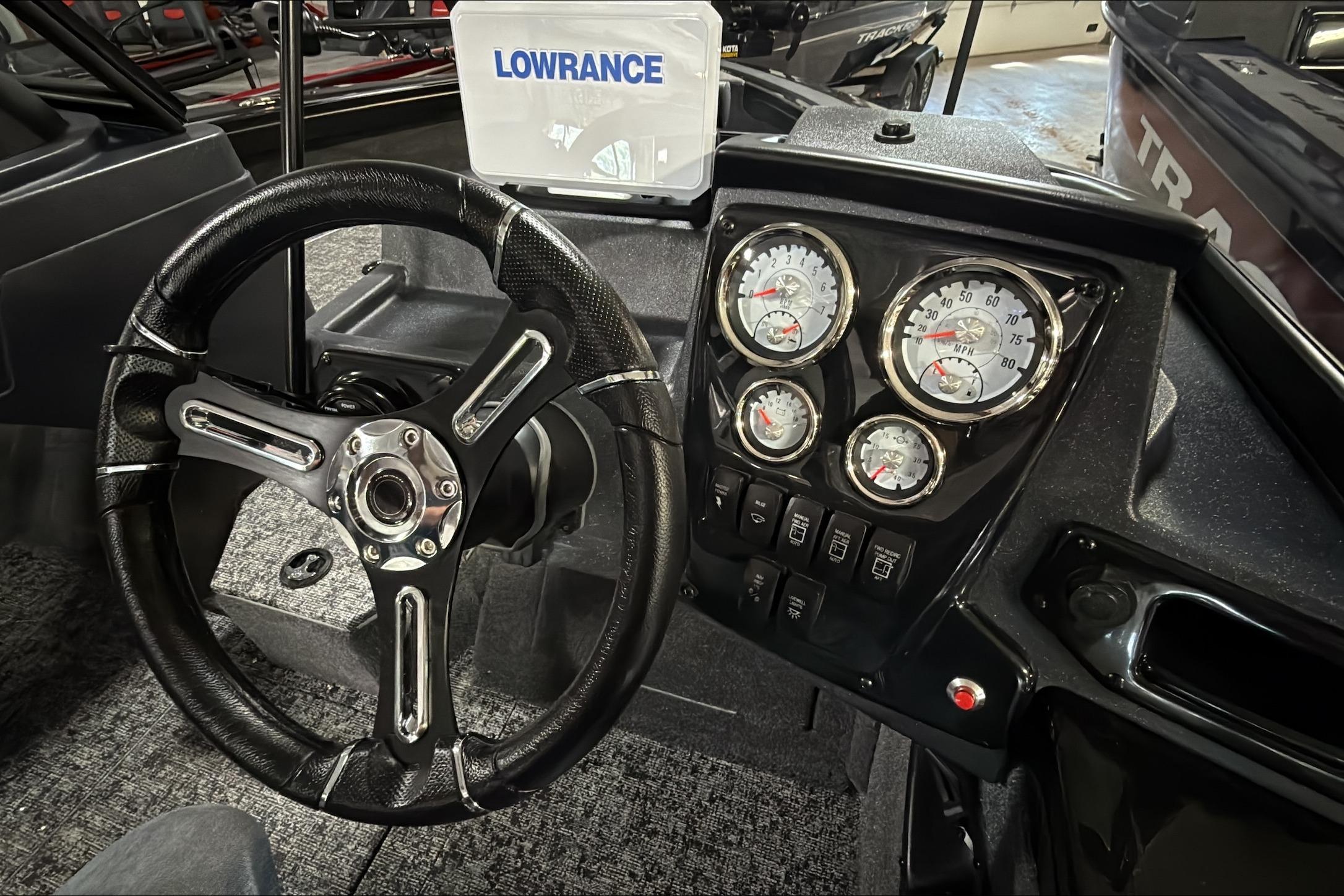 2026 Tracker Targa V-18 WT dashboard with steering wheel and gauges.