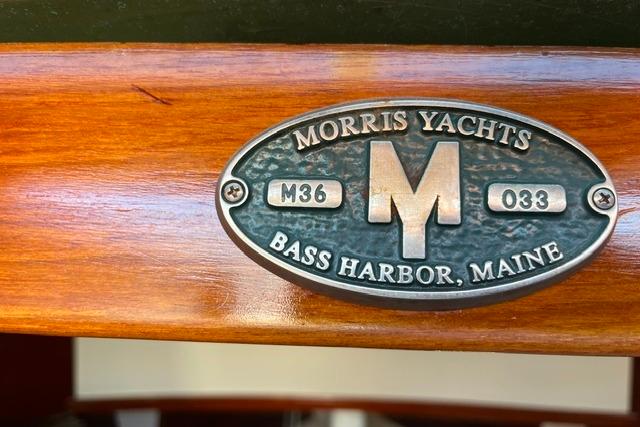 Plaque of 2006 Morris 36 yacht, Bass Harbor, Maine, on polished wood surface.
