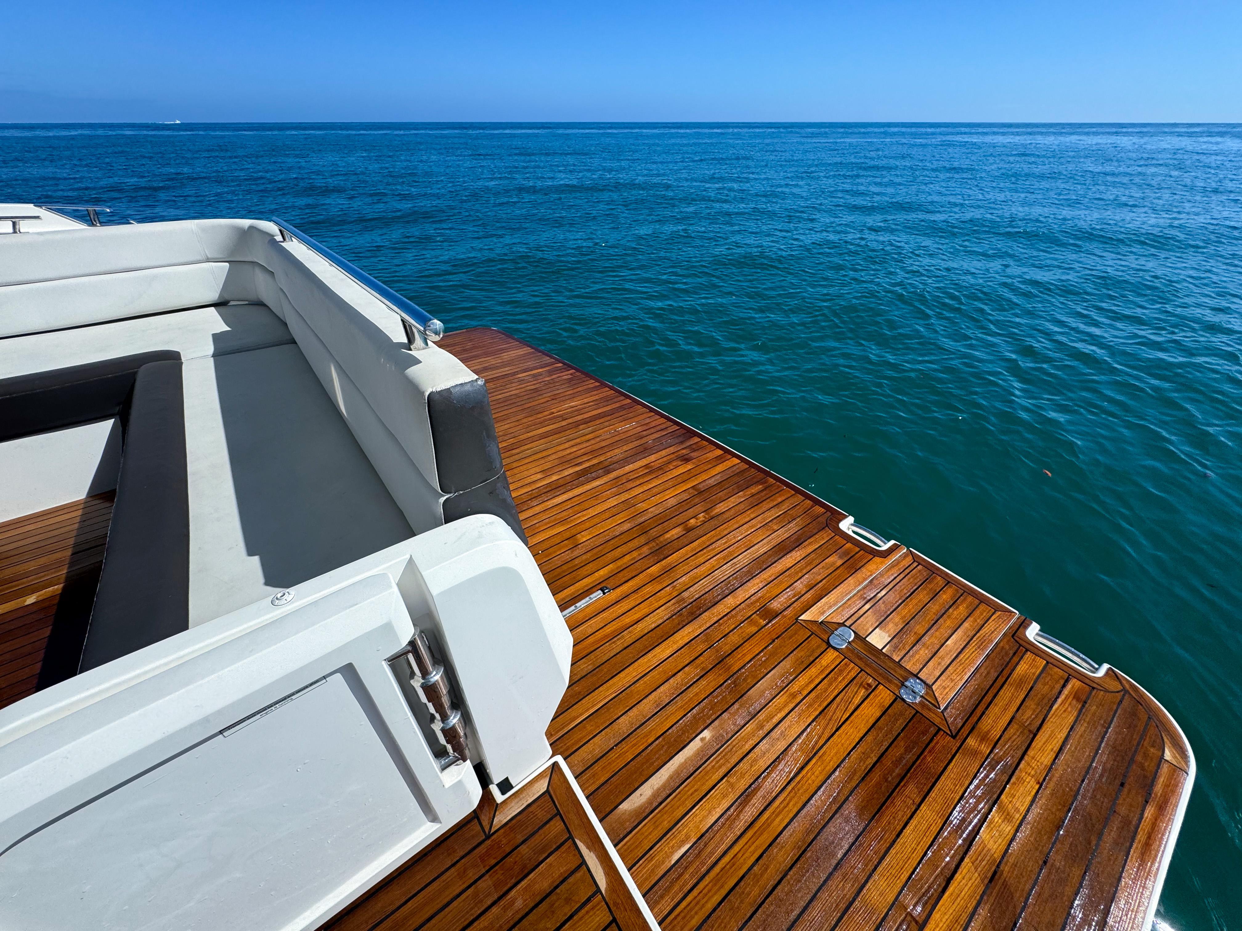 Galeon 420 Fly 2016 yacht deck with ocean view, featuring sleek wooden finish.