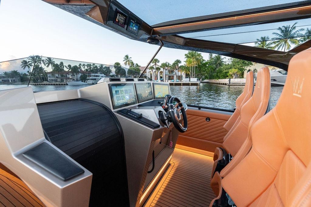 Luxurious 2023 DeKoning 43 yacht interior with advanced navigation system and plush seating.