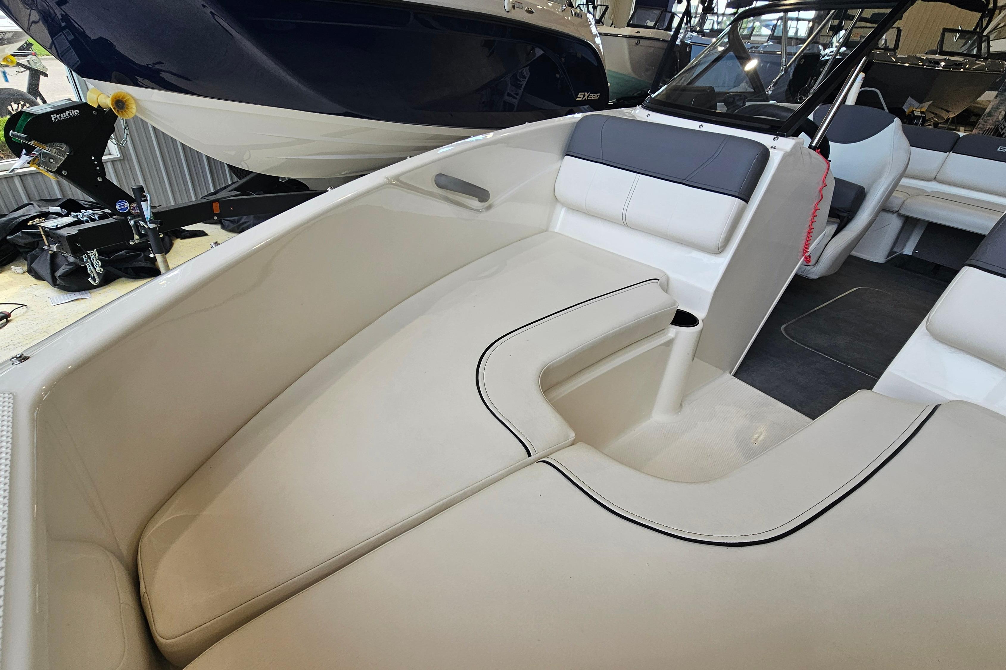 2019 Bayliner 170 Bowrider interior with white and gray seating, showcasing spacious design.