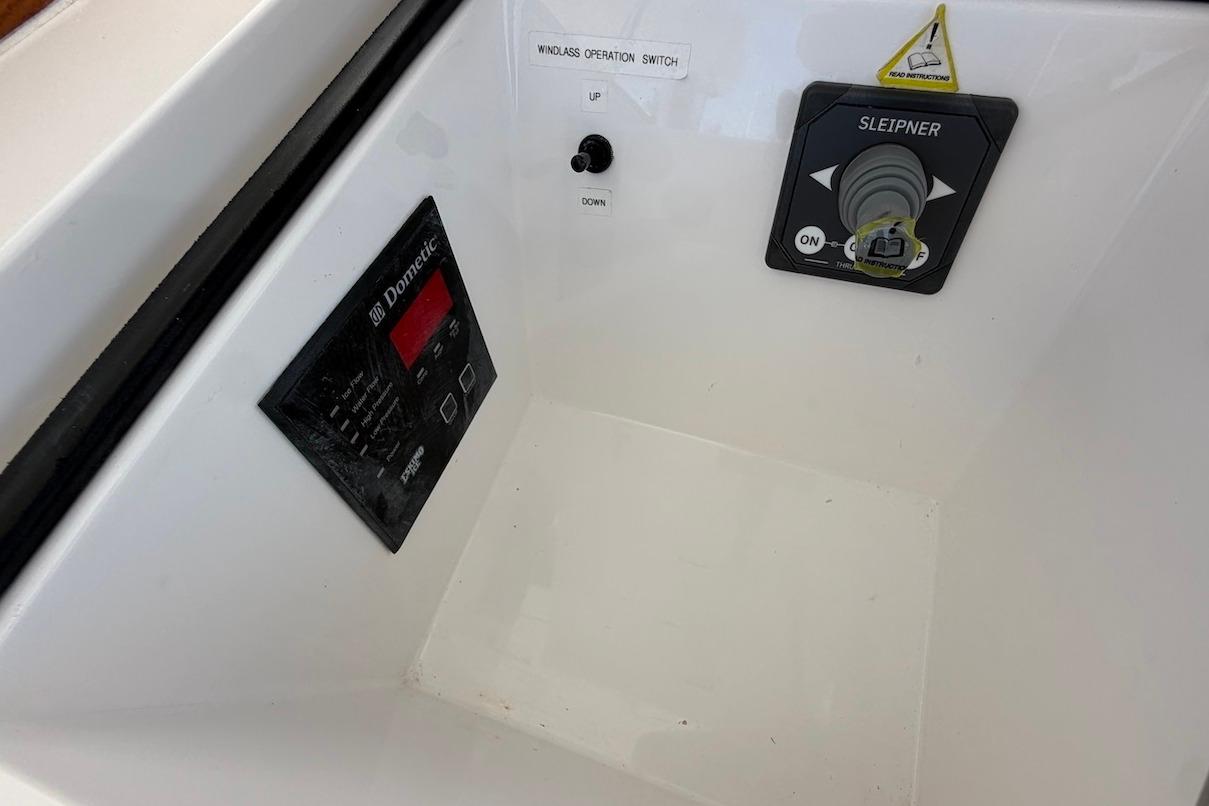 Control panel of a 2012 Viking 50 Convertible boat featuring Dometic and Sleipner systems.