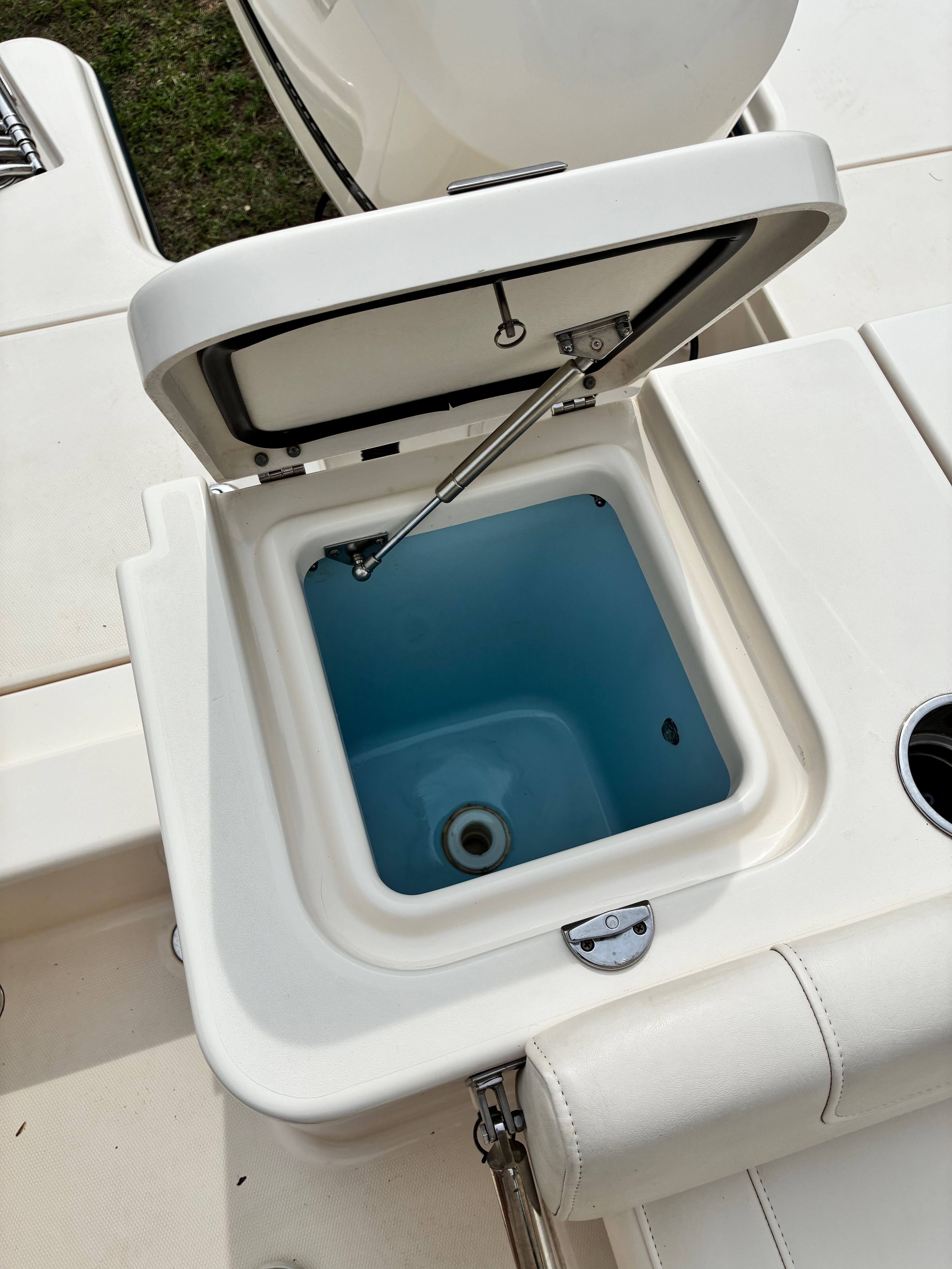 Open storage compartment on a 2018 Grady-White Freedom235 boat.