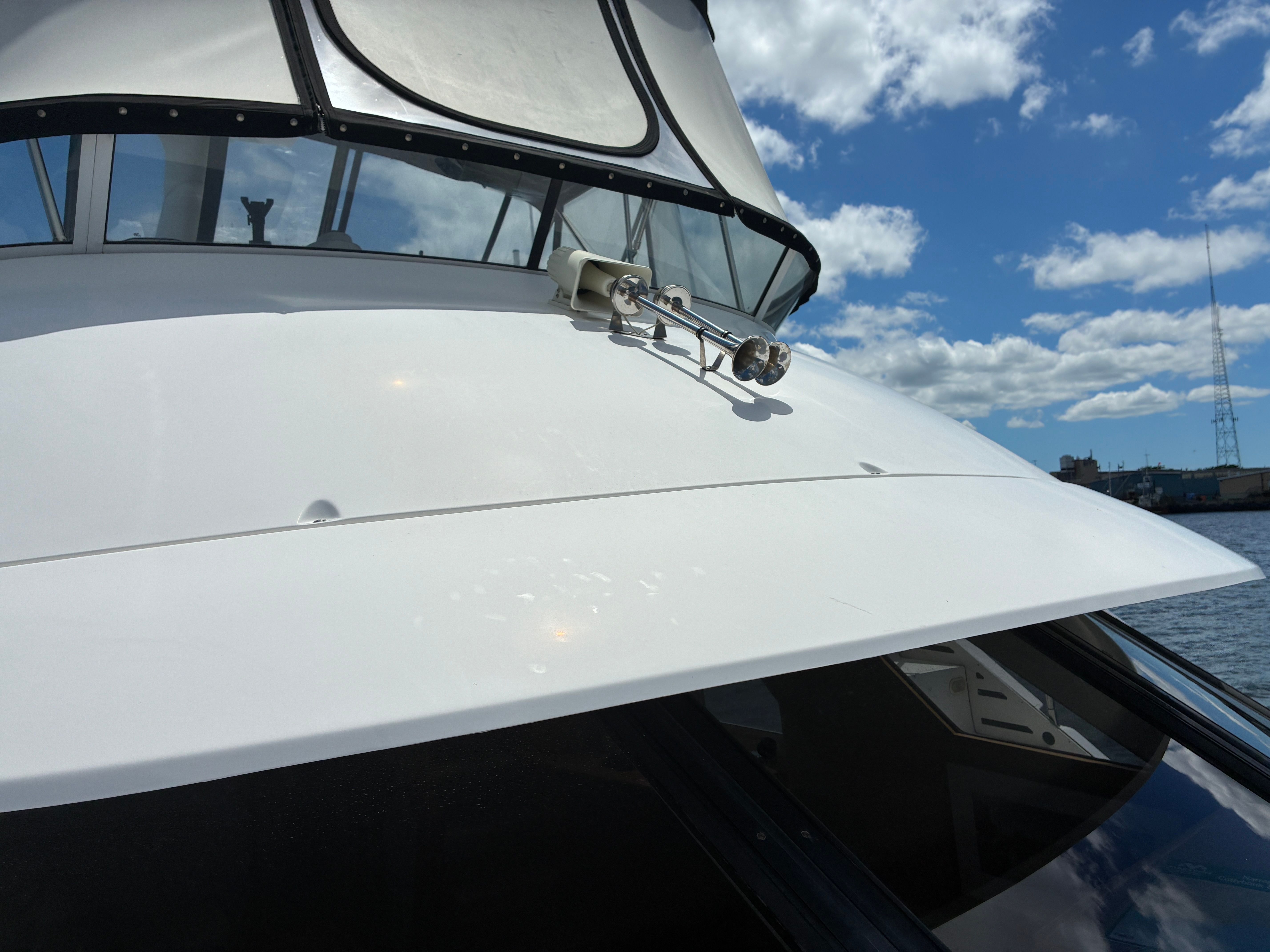 The 2001 Silverton 392 Motor Yacht features a sleek white deck with clean lines.
