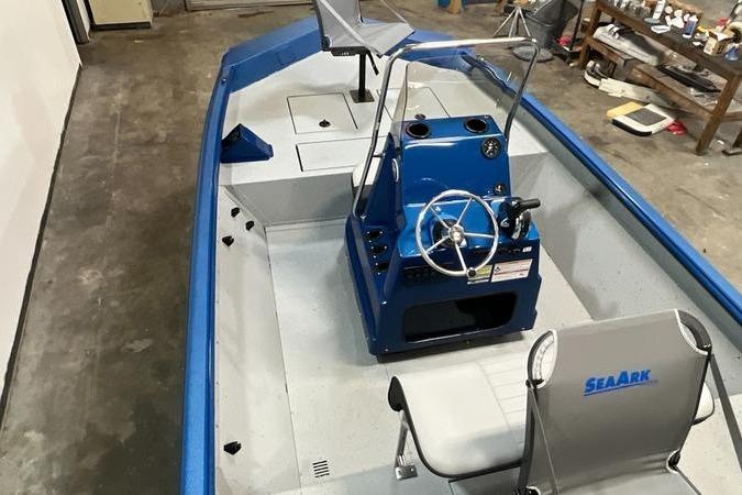 2025 SeaArk Shadow 187T boat interior with blue console and seating.
