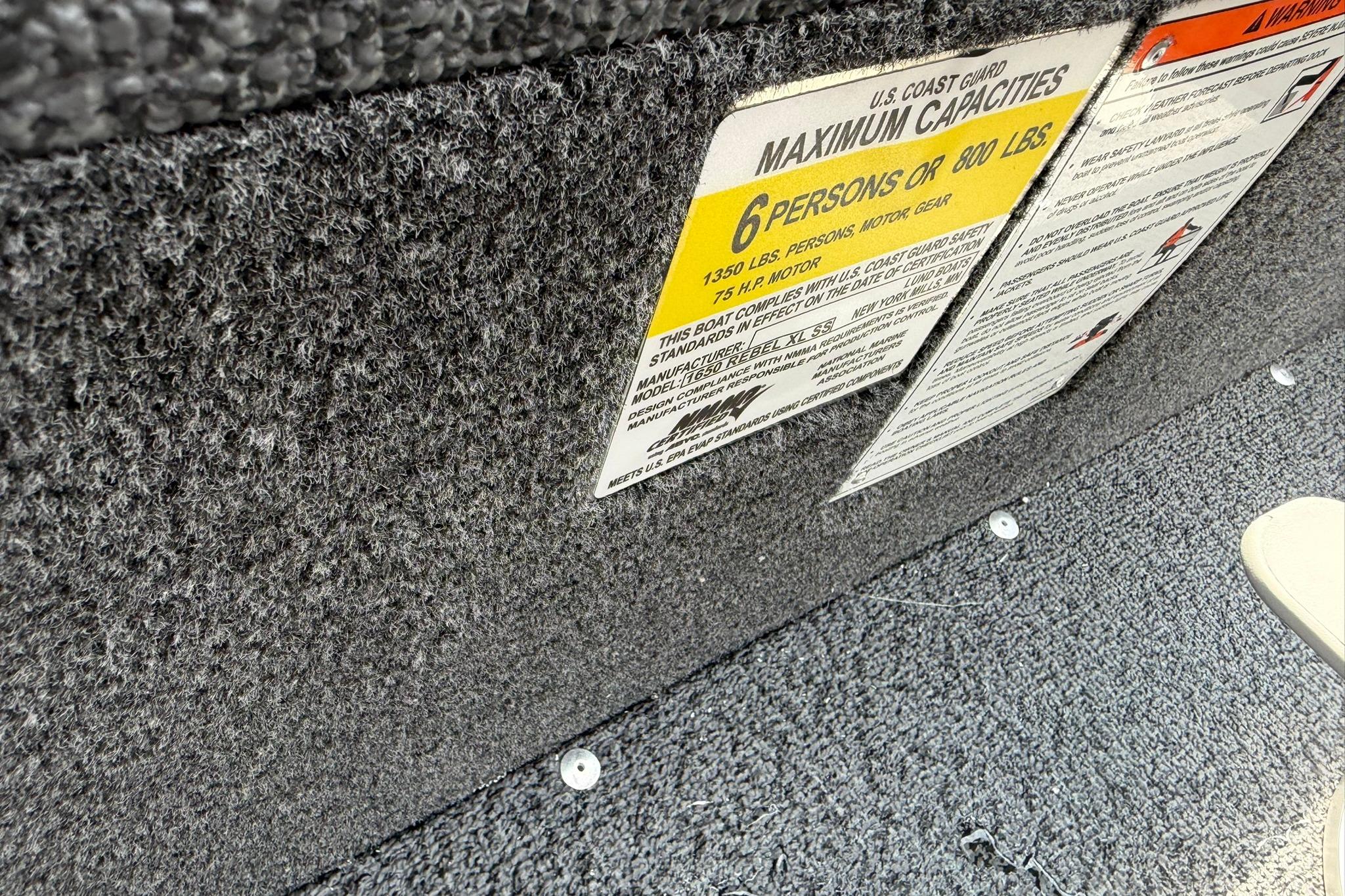 2027 Lund 1650 Rebel XL SS boat capacity label, showing maximum 6 persons or 800 lbs.
