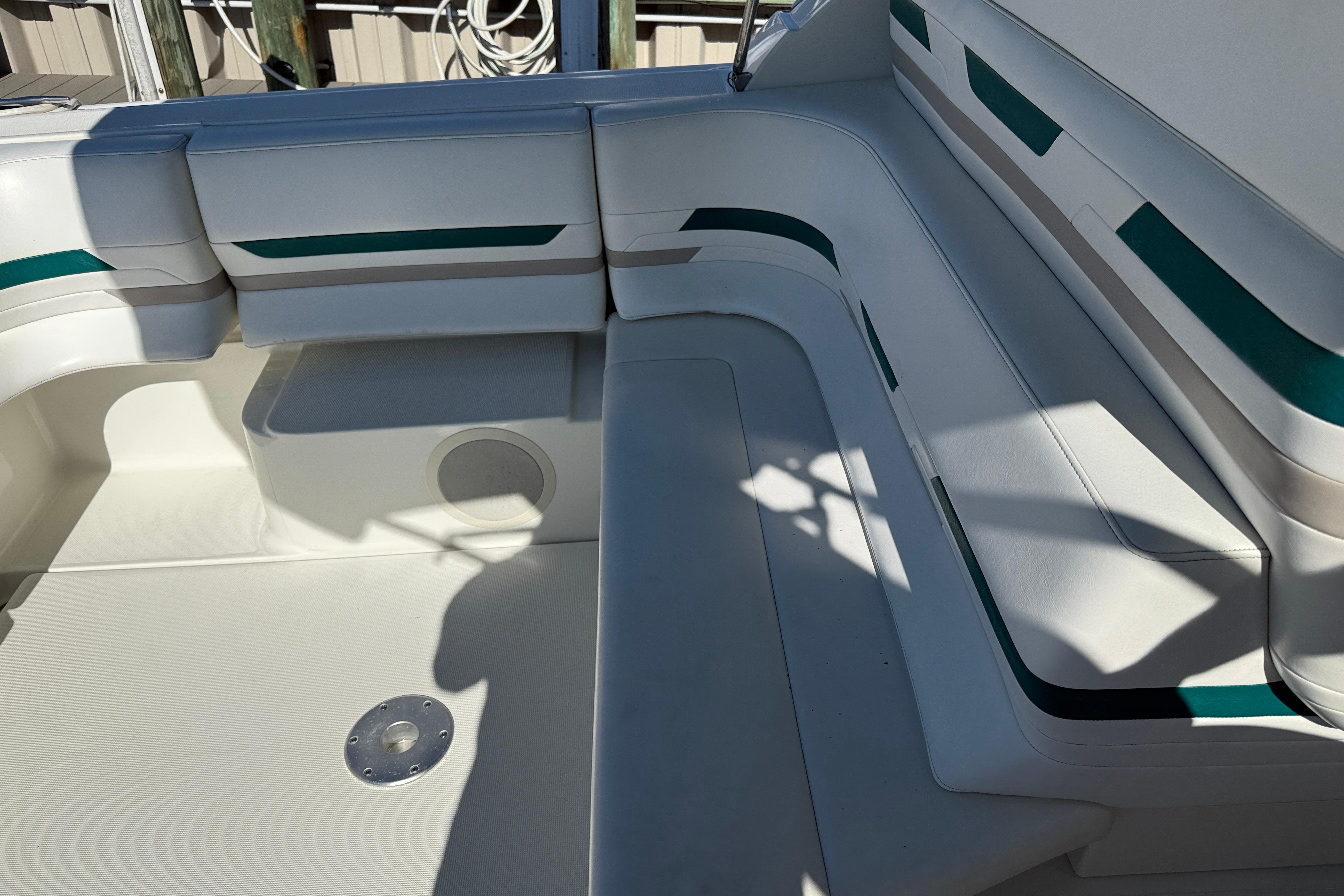1998 Formula 34 Performance Cruiser interior seating with white and teal accents.