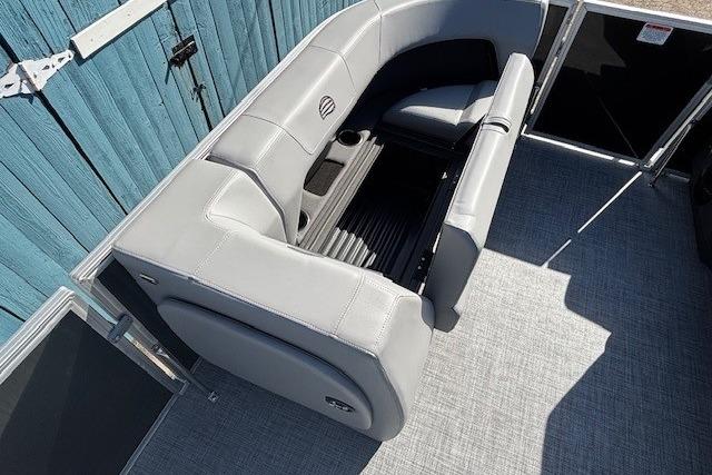 2026 Sun Tracker Party Barge 18 DLX with gray seating and spacious deck layout.