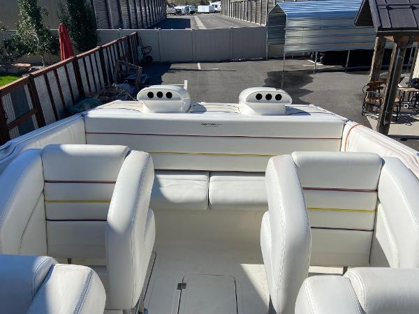 2002 Advantage Victory boat interior with white seating and colorful stripes.