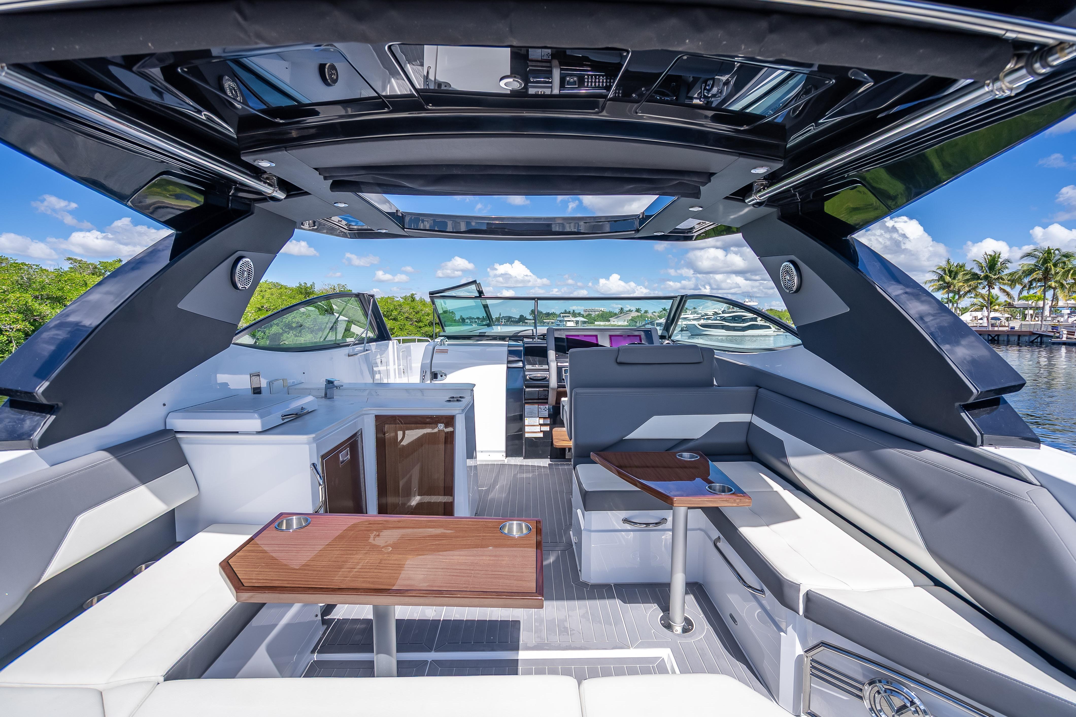 Luxurious 2022 Cruisers Yachts 38 GLS OB interior with sleek seating and modern amenities.