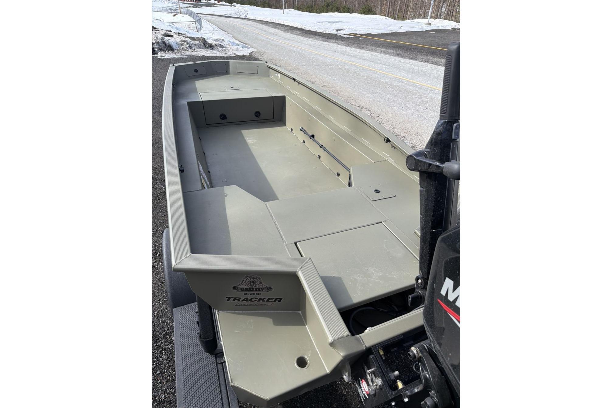 2026 Tracker Grizzly 1650 T Prairie Wings Edition boat on snowy roadside.