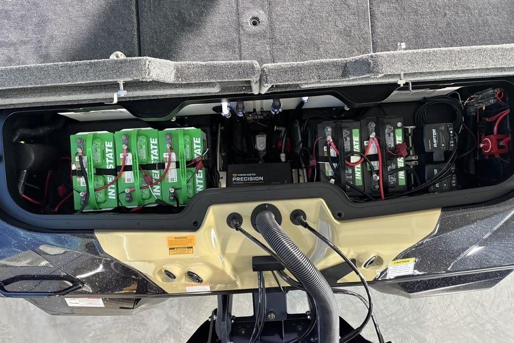 2026 Skeeter ZXE21 boat battery compartment with Interstate batteries and wiring.