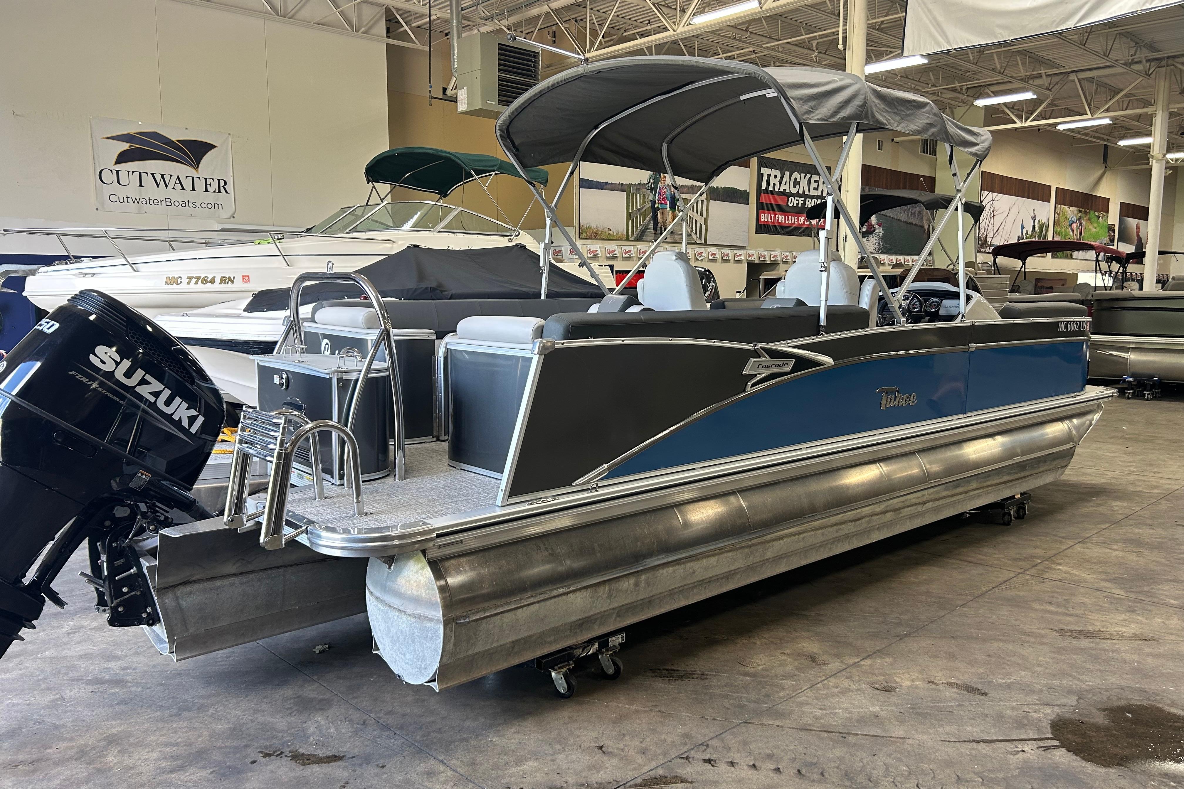 2022 Tahoe Pontoon Cascade Quad Lounger with Suzuki engine in showroom.